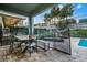 Outdoor patio with a dining set, safety fence, and lounge seating at 350 Pendant Ct, Kissimmee, FL 34747