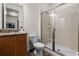 Neutral bathroom with a stand-up shower, granite counter top, and modern toilet at 350 Pendant Ct, Kissimmee, FL 34747