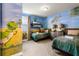 Themed bedroom featuring bright, colorful, hand-painted art at 350 Pendant Ct, Kissimmee, FL 34747