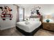 Bedroom features Mickey and Minnie Mouse wall decor, with wood-framed bed and matching nightstands at 350 Pendant Ct, Kissimmee, FL 34747