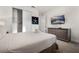Well-lit bedroom with a TV, dresser, closet, and an accessible doorway at 350 Pendant Ct, Kissimmee, FL 34747