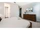 Comfortable bedroom with TV, dresser, and bright natural light at 350 Pendant Ct, Kissimmee, FL 34747