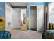Whimsical bedroom with Disney themed wall and decor, featuring a large closet and multiple doorways at 350 Pendant Ct, Kissimmee, FL 34747