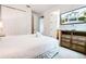 Bright bedroom with a TV, closet, and view into the ensuite bathroom at 350 Pendant Ct, Kissimmee, FL 34747