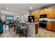 Spacious kitchen with granite countertops, stainless steel appliances, and an island with bar seating at 350 Pendant Ct, Kissimmee, FL 34747