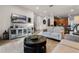An open concept floor plan with a tile floor, and easy access to the kitchen and stairs at 350 Pendant Ct, Kissimmee, FL 34747