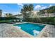Beautiful pool surrounded by lush landscaping and lounge chairs at 350 Pendant Ct, Kissimmee, FL 34747