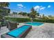 Relaxing poolside lounge area with comfortable seating and mature landscaping at 350 Pendant Ct, Kissimmee, FL 34747