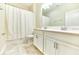 Clean bathroom with double vanity and bathtub shower combo at 4310 Seven Canyons Dr, Kissimmee, FL 34746