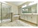 Spa-like bathroom featuring a double vanity, large shower, and soaking tub at 4310 Seven Canyons Dr, Kissimmee, FL 34746