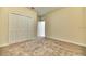Spacious bedroom with neutral carpeting and a large closet at 4310 Seven Canyons Dr, Kissimmee, FL 34746