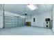 Attached garage with garage door opener and utility space at 4310 Seven Canyons Dr, Kissimmee, FL 34746