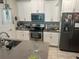Modern kitchen with stainless steel appliances and island at 4310 Seven Canyons Dr, Kissimmee, FL 34746