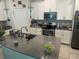 Modern kitchen with gray counters and white cabinets at 4310 Seven Canyons Dr, Kissimmee, FL 34746