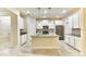 Modern kitchen featuring a large island, stainless steel appliances, and white cabinets at 4310 Seven Canyons Dr, Kissimmee, FL 34746