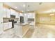 Spacious kitchen boasts an expansive island, stainless steel appliances, and white cabinets at 4310 Seven Canyons Dr, Kissimmee, FL 34746