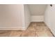 Finished basement with tile floors, neutral walls, and ample space for storage at 4571 Tribute Trl, Kissimmee, FL 34746