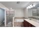 Bathroom with a soaking tub, separate shower, and vanity with double sinks at 4571 Tribute Trl, Kissimmee, FL 34746