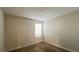 A simple bedroom includes carpet, a window with blinds and neutral colored walls at 4571 Tribute Trl, Kissimmee, FL 34746