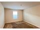 Neutral bedroom with carpeting and a window providing natural light at 4571 Tribute Trl, Kissimmee, FL 34746