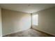 Cozy bedroom featuring a window for natural light and neutral-toned walls at 4571 Tribute Trl, Kissimmee, FL 34746