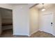 Bright foyer with tile floors, white door and adjacent workspace at 4571 Tribute Trl, Kissimmee, FL 34746