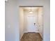 Bright foyer featuring tile flooring, a pendant light fixture, and a white front door at 4571 Tribute Trl, Kissimmee, FL 34746