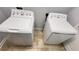 Close up of the white washer and dryer set in the laundry room at 4571 Tribute Trl, Kissimmee, FL 34746