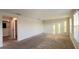 Spacious living room with multiple windows and an open doorway at 4571 Tribute Trl, Kissimmee, FL 34746