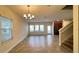 Open-concept living space with tile flooring and natural light at 4571 Tribute Trl, Kissimmee, FL 34746