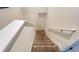 Carpeted stairs with white trim provide access to the upper level of the home at 4571 Tribute Trl, Kissimmee, FL 34746
