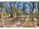 Backyard view from upper level showing mature trees and partial lake view at 4855 Lillian Black Rd, St Cloud, FL 34771