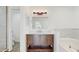 Bathroom vanity with drawers, a soaking tub and a glass-door shower at 4855 Lillian Black Rd, St Cloud, FL 34771