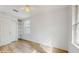 Bedroom featuring wood-look flooring and a built-in shelving unit at 4855 Lillian Black Rd, St Cloud, FL 34771