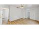 Spacious bedroom with wood-look tile flooring and closet at 4855 Lillian Black Rd, St Cloud, FL 34771