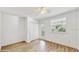 Bedroom featuring wood-look floors, a closet, a ceiling fan and a window at 4855 Lillian Black Rd, St Cloud, FL 34771