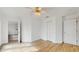 Neutral bedroom featuring wood-look floors, a ceiling fan, and a closet at 4855 Lillian Black Rd, St Cloud, FL 34771
