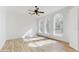 Bright bedroom with hardwood floors featuring three large arched windows at 4855 Lillian Black Rd, St Cloud, FL 34771
