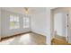 Bedroom with wood-look flooring and lots of natural light at 4855 Lillian Black Rd, St Cloud, FL 34771