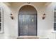 Front entrance of the home featuring a large double door at 4855 Lillian Black Rd, St Cloud, FL 34771