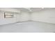 Spacious garage features a neutral color scheme and natural light from the window for multiple uses at 4855 Lillian Black Rd, St Cloud, FL 34771