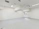 Spacious garage features a neutral color scheme and natural light from the window for multiple uses at 4855 Lillian Black Rd, St Cloud, FL 34771