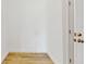 Hallway features wood-look tile flooring and a white door with gold hardware at 4855 Lillian Black Rd, St Cloud, FL 34771