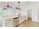 Stylish kitchen featuring white cabinets and quartz counters with stainless steel appliances and breakfast bar at 4855 Lillian Black Rd, St Cloud, FL 34771