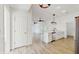 Modern kitchen with stainless steel appliances, a large sink, quartz counters, and white cabinets at 4855 Lillian Black Rd, St Cloud, FL 34771