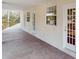 Covered patio with lots of natural light and three doorways to inside at 4855 Lillian Black Rd, St Cloud, FL 34771