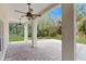Covered brick patio supported by large white pillars at 4855 Lillian Black Rd, St Cloud, FL 34771