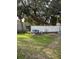 Backyard featuring mature trees and a white fence at 626 Baldwin Dr, Kissimmee, FL 34758