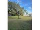 Backyard with basketball hoop and green grass at 626 Baldwin Dr, Kissimmee, FL 34758