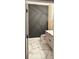 Modern bathroom with geometric dark gray accent wall at 626 Baldwin Dr, Kissimmee, FL 34758